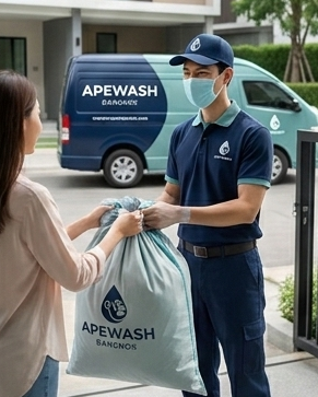Apewash pickup staff receiving a laundry bag